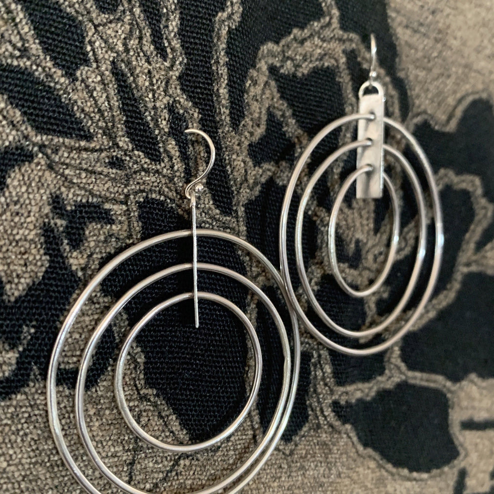 
            
                Load image into Gallery viewer, Saturn Hoops earrings Salt and Steel Jewelry Lightweight Saturn Hoops 
            
        